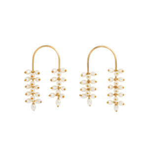 "Fior de Loto earrings featuring 24k gold-plated arches and cascading white pearls"